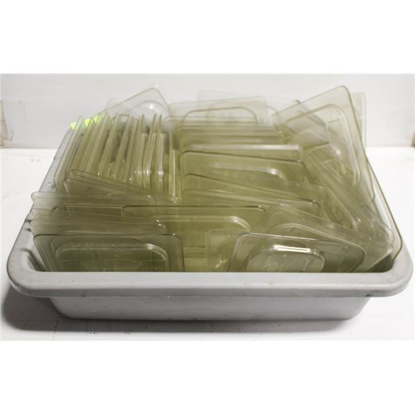 BUSSING TRAY OF VARIOUS SIZED PLASTIC INSERT LIDS