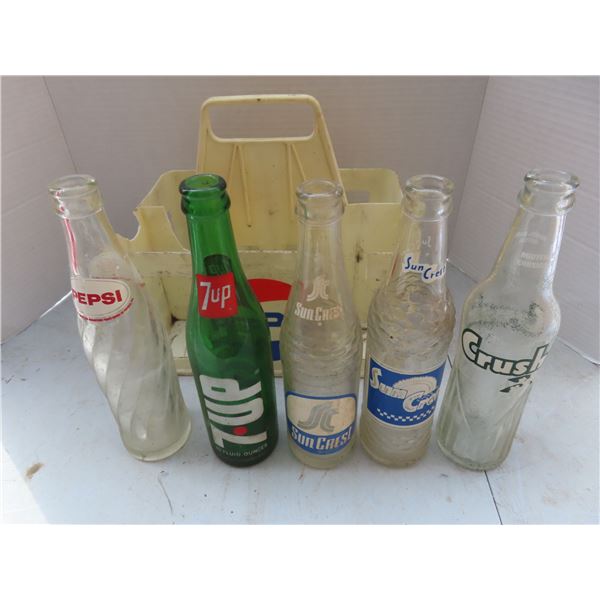 sun crest , crush , 7up , pepsi bottles and case