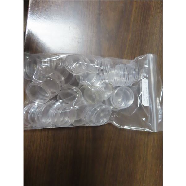 Lot of 50 hard plastic holders for coins. Most are for Canadian silver dollars. Used once.