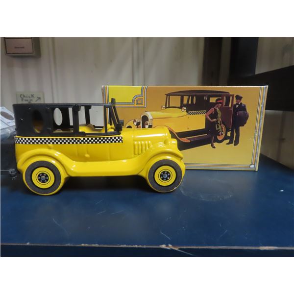 Avon 1926 Checker Cab. 5-ounce yellow painted over clear glass. Black plastic trunk cap & top. House