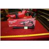 Image 1 : Milwaukee Cordless Compact Vacuum with battery, working.