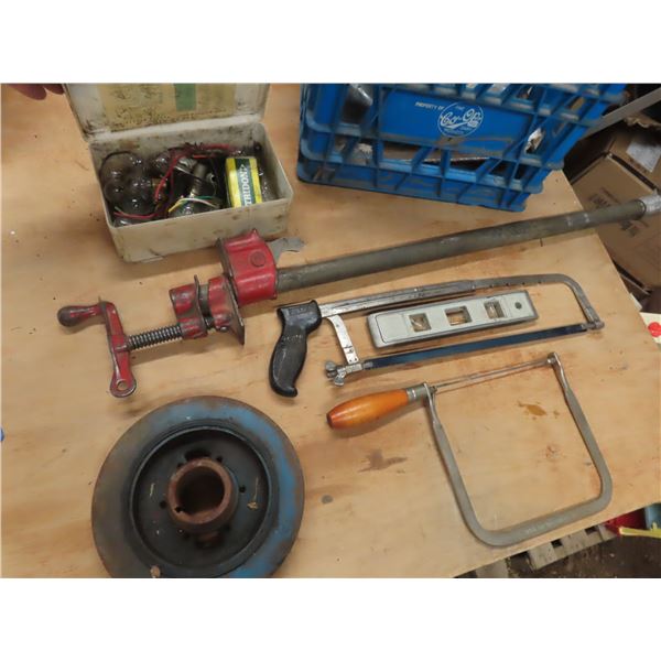 hacksaw , wood clamps , roll of seat belt material , assorted lights