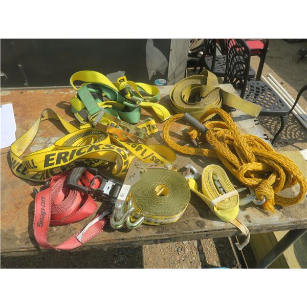 tote of assorted ratchet straps and tow straps