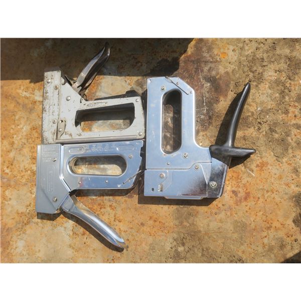 3 staple guns and a tote of staples