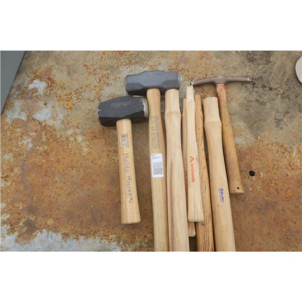 assorted hammers and tool handles