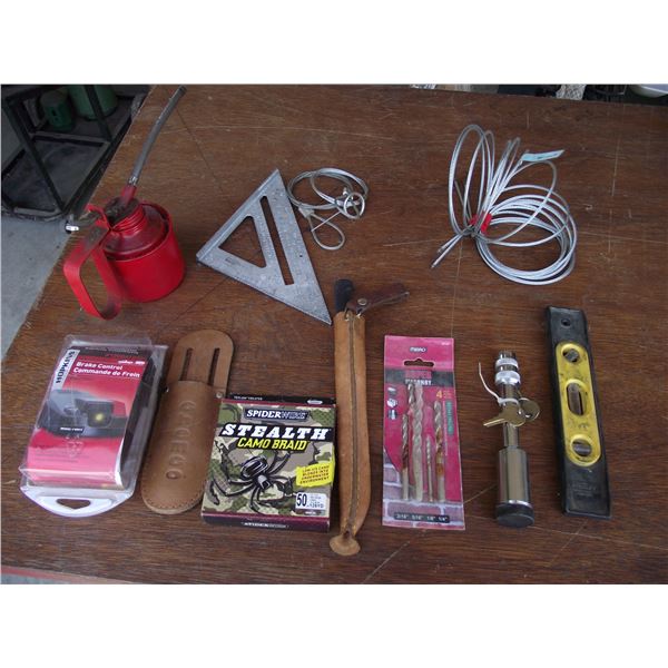 1-Brake control (new), oilcan, square, level, hitch lock, bits, small cable, fish line and knife she