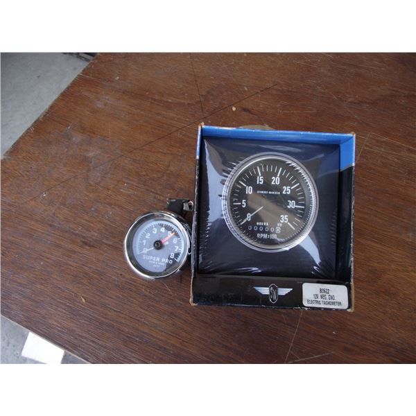 2-Tachometers 1-stewart waner new in box, 1- super pro used.