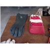 Image 1 : 7 Pairs of assorted gloves, 1 pair of rubber boot liners (new), and 4 bunge cords.