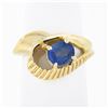 Image 1 : 14k Gold 0.80 ctw Oval Sapphire Solitaire Polished Grooved Open Loop Bypass Ring