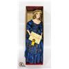 Image 1 : ARTISAN PORCELAIN DOLL IN BLUE DRESS