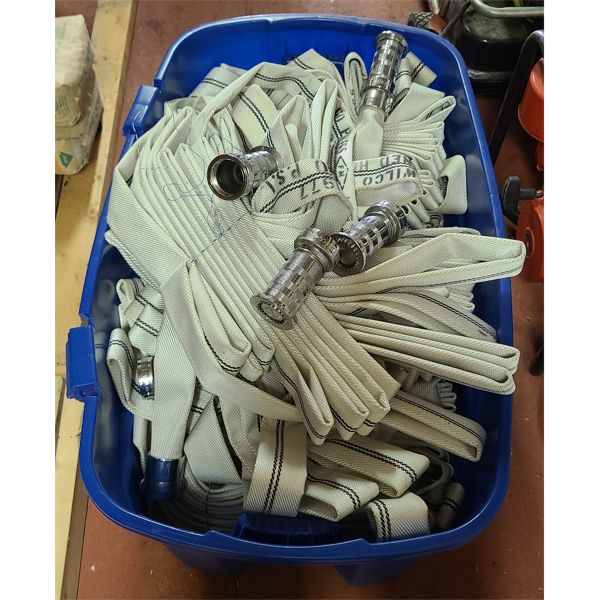 BIN OF 6+ FIRE HOSES AND SOME EXTRA NOZZLES