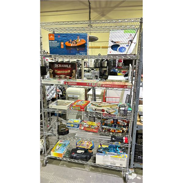 RACK OF ASSORTED GAMES AND TOYS *RACK NOT INCLUDED*