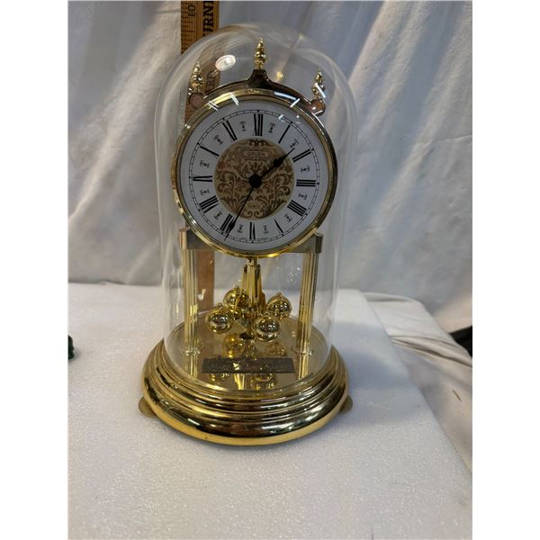 Courts anniversary clock with glass dome