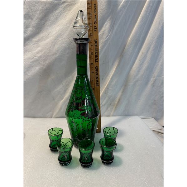 green glass decanter and shooter glasses with silver overlay