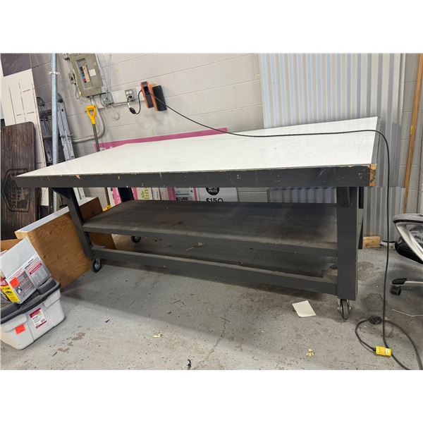 Rolling shop table 97 1/2 inches long 49 3/4 inches wide 40 1/2 inches tall