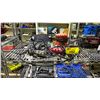 Image 2 : SHELF OF ASSORTED ITEMS INCLUDING; BENCH GRINDER, MOTOMASTER BATTERY CHARGER, PALM SANDER & MORE