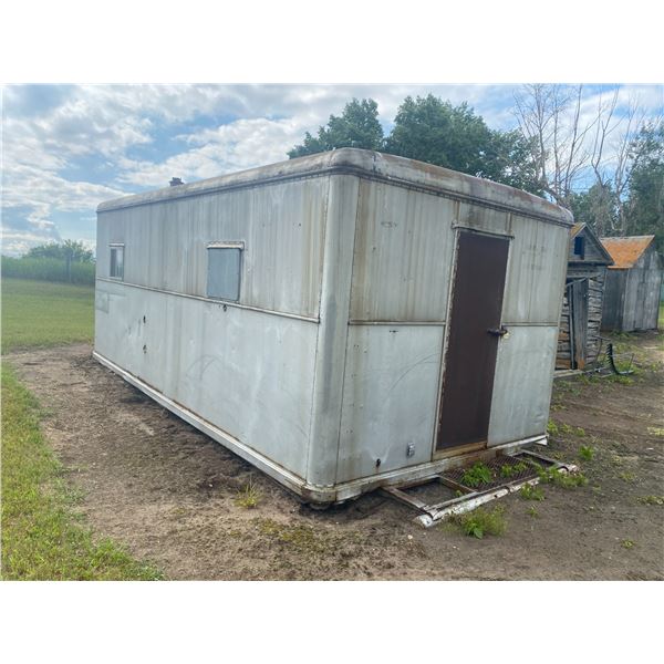 LOADER IS NOT AVAILABLE TO LOAD THIS ITEM. Approx. 20ft Older Metal Skid Unit, has water leak, front