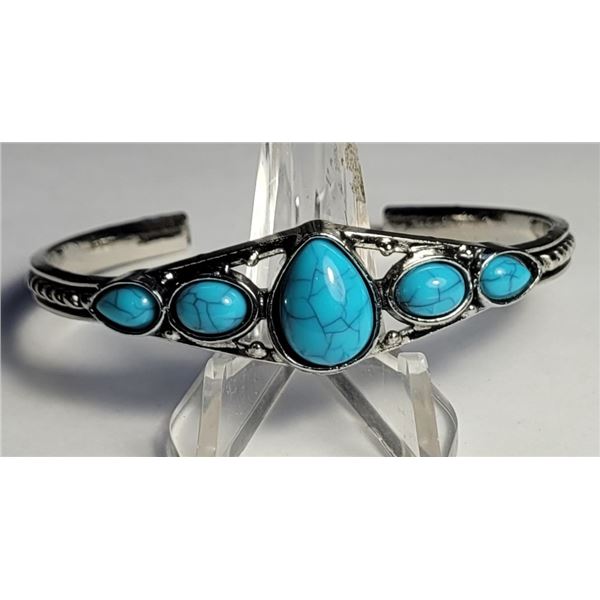 24)  TIBETAN SILVER AND NATURAL PEAR SHAPED TURQUO