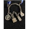 Image 2 : 925 Sterling Silver Link Bracelet with Miscellaneous Charms. Windmill Moves