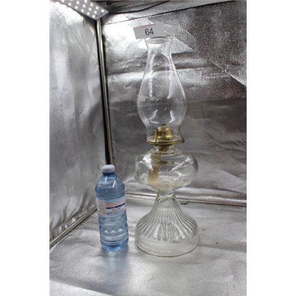 Antique clear glass oil lamp