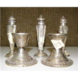 Lot of 5: 2 silver candle stick holders and three salt and pepper shakers (2)