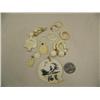 Image 1 : Lot of: 1 scrimshawed ivory pendant, 4 ivory pendant, 3 ivory rings, 3 pair ivory earrings, ivory ro