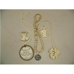 Lot of 5: beautiful carved ivory orchid, ivory pendant with gold rim, ivory peacock, ivory pendant a