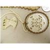 Image 2 : Lot of 5: beautiful carved ivory orchid, ivory pendant with gold rim, ivory peacock, ivory pendant a