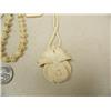 Image 4 : Lot of 5: beautiful carved ivory orchid, ivory pendant with gold rim, ivory peacock, ivory pendant a