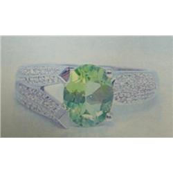 Peridot and diamond lady's ring, 14K white gold, peridot oval, faceted, approx. 2 carats, transparen