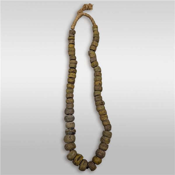 A Large 19th Century Straw String Of Yellow And Green Hebron Glass Beads, 57 Beads