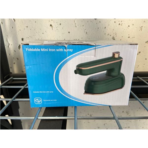 Foldable mini clothing iron with spray function