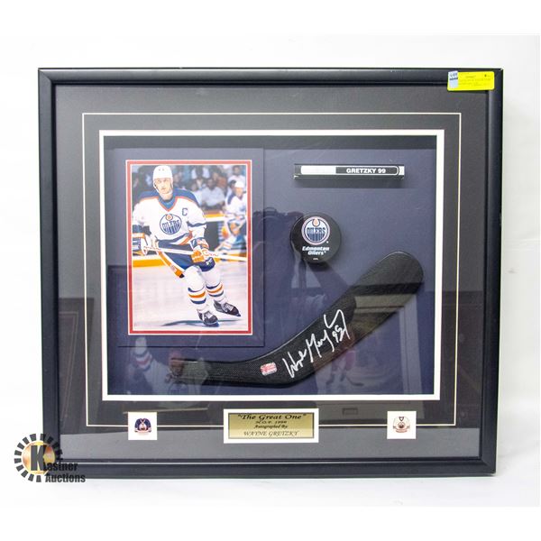 SIGNED STICK, PUCK AND PICTURE AUTOGRAPHED BY "THE