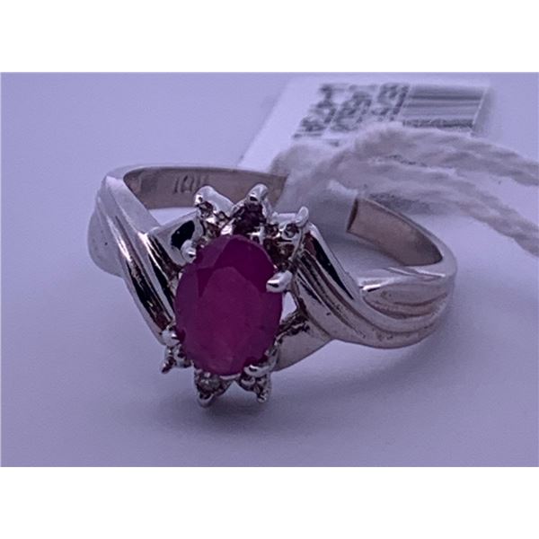10k white gold ring with pink centre stone, and small clear accent stones (2); weighs 2.38 grams.