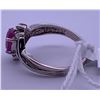 Image 2 : 10k white gold ring with pink centre stone, and small clear accent stones (2); weighs 2.38 grams.