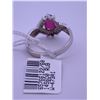 Image 3 : 10k white gold ring with pink centre stone, and small clear accent stones (2); weighs 2.38 grams.