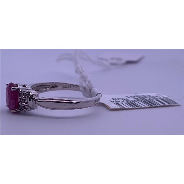 14k white gold ring with a pink centre stone, and 6 clear side accent stones; weighs 2.42 grams.