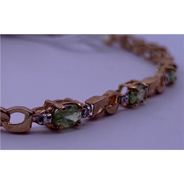 10k yellow gold bracelet with peridot accented by melee diamonds; weighs 3.97 grams.