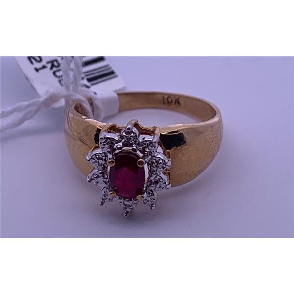 10k yellow gold ring with a centre ruby; weighs 2.56 grams.