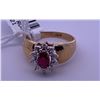 Image 1 : 10k yellow gold ring with a centre ruby; weighs 2.56 grams.