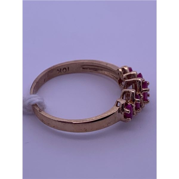 10k yellow gold ring with 5 pink marquis cut stones; weighs 2.10 grams.
