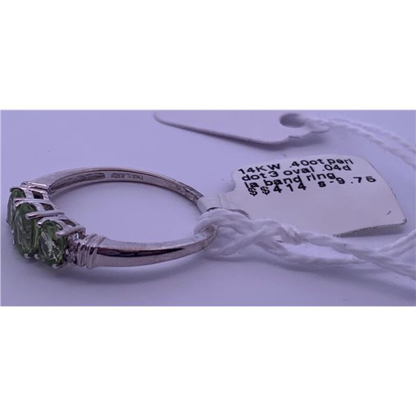 14k white gold ring with 3 centre peridots, and clear accent melee diamonds; weighs 2.76 grams.