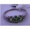 Image 4 : 14k white gold ring with 3 centre peridots, and clear accent melee diamonds; weighs 2.76 grams.