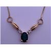 Image 1 : 10k yellow gold necklace with emerald, accented by two melee diamonds; weighs 2.43 grams.