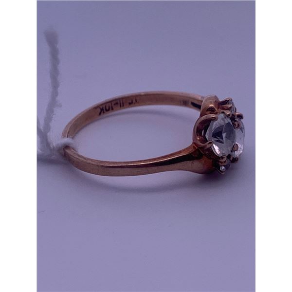10k yellow gold ring with 2 large colorless centre stones; weighs 2.19 grams.