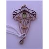 Image 1 : 10k rose gold pendant with 2 peridots; weighs 2.25 grams.