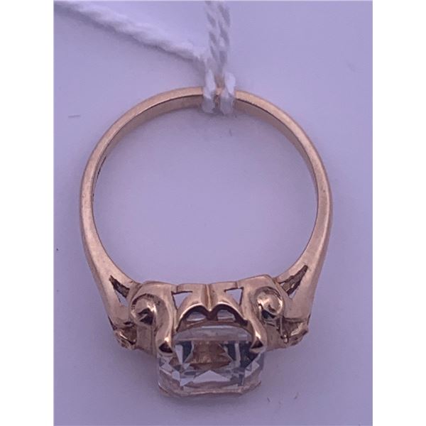 14k yellow gold ring with large emerald cut colourless stone; weighs 3.22 grams
