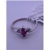 Image 4 : 10k white gold ring with ruby centre stone, and 2 melee diamonds; weighs 1.56 grams