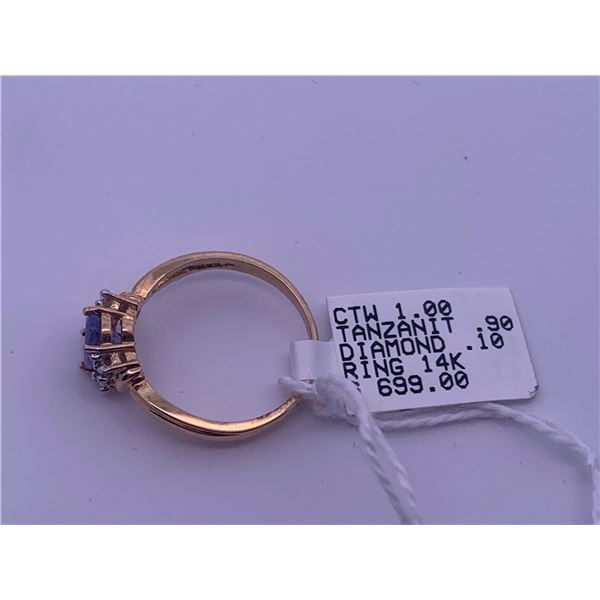 14k yellow gold ring with tanzanite centre stone and 6 melee diamonds; weighs 2.26 grams