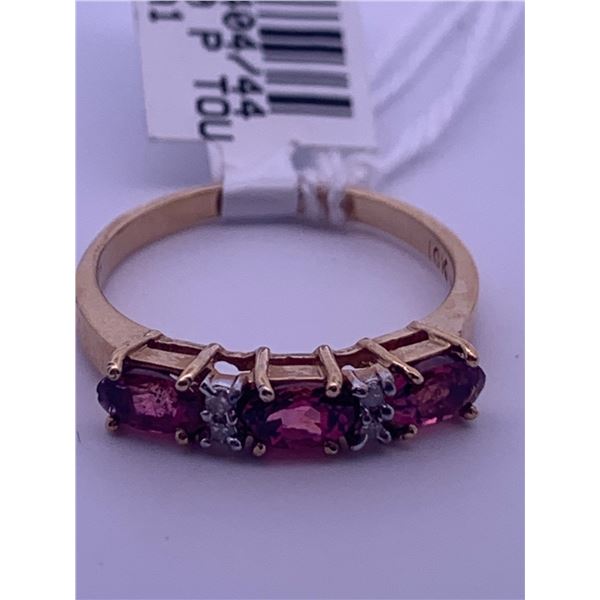 10k yellow gold ring with 3 pink tourmaline stones, and 4 melee diamonds; weighs 2.23 grams